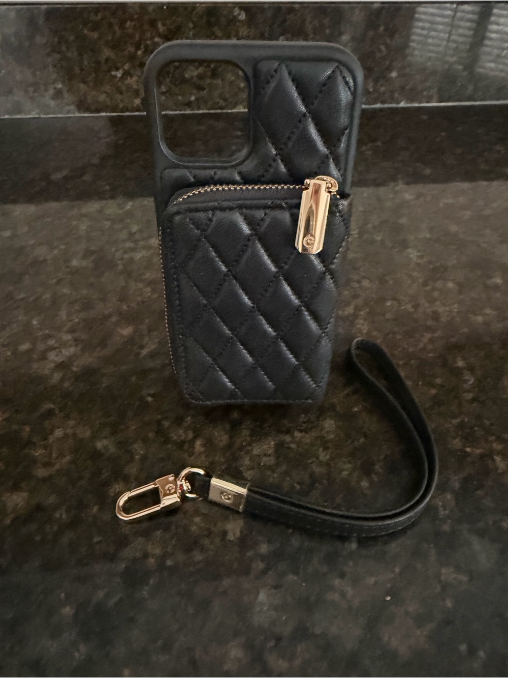 Quilted Black Wallet Phone Case with Gold detail.